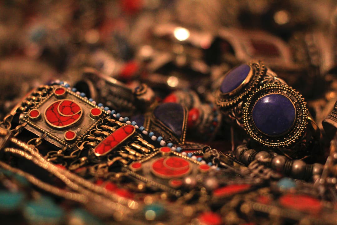 Traditional gold jewelry with intricate patterns and red gemstones for festivals