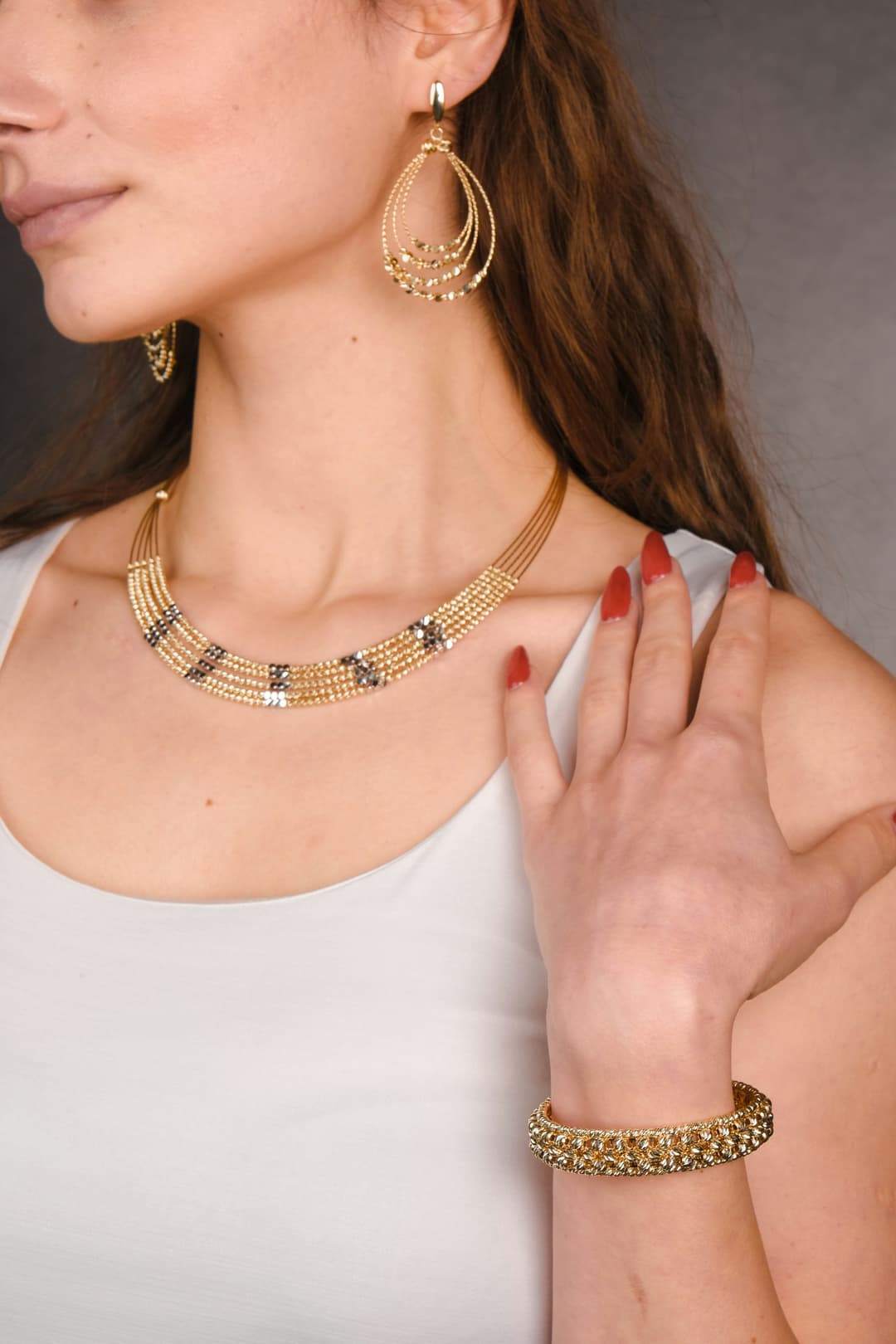 Simple yet elegant daily wear jewelry including delicate chain and small earrings