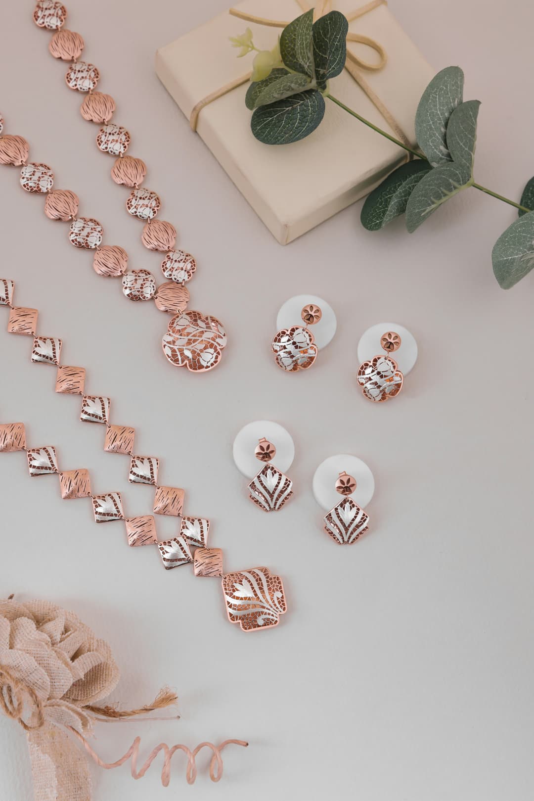 Contemporary gold jewelry pieces with modern geometric designs and polished finish